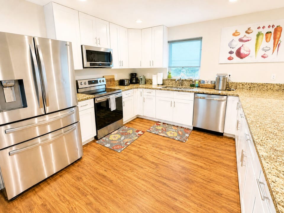 Fully stocked oceanfront kitchen with generous island seating