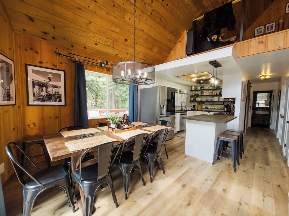 Large dining area with seating for 11-12 guests.