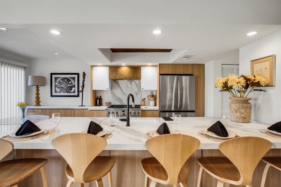 Gather around the stylish kitchen bar with seating for five. Step into a chef’s paradise in this modern kitchen, where functionality meets style. It invites you to cook and gather with friends and family, creating delicious memories!