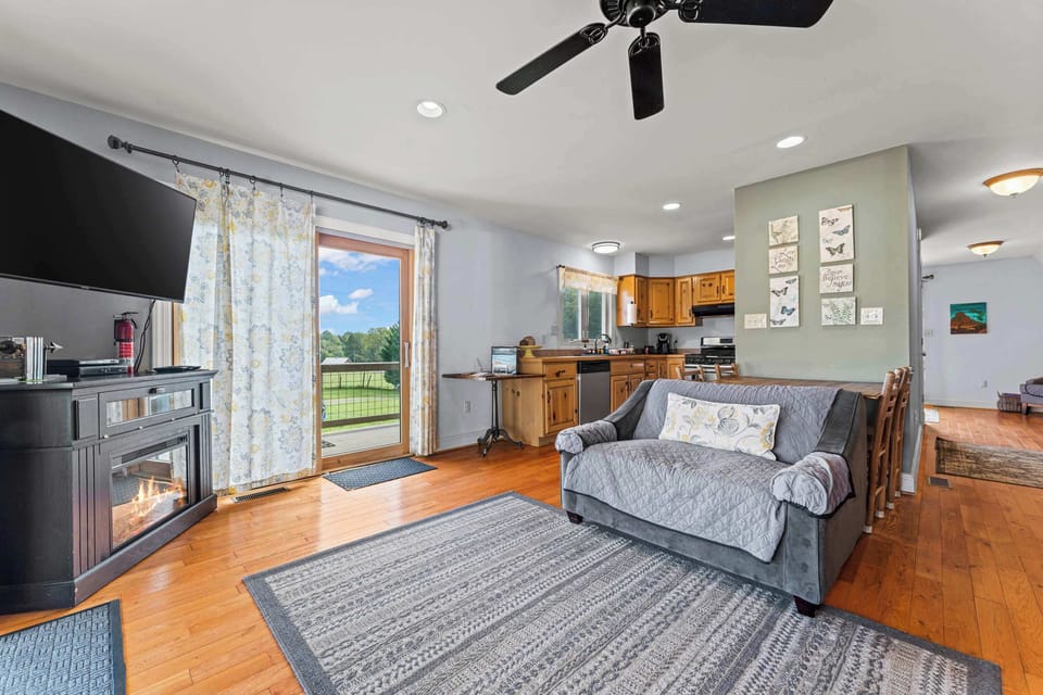 The open floor concept seamlessly connects the kitchen and living area, creating a spacious and inviting atmosphere.
