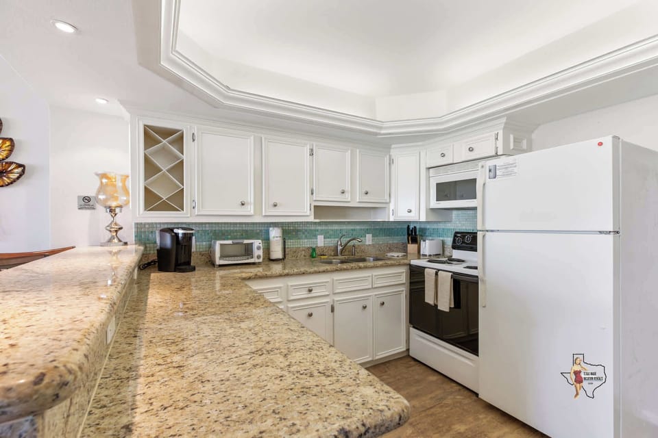 Gorgeous granite countertops and lots of space for meal prep
