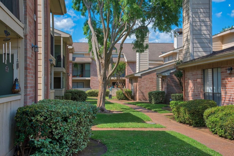 Enjoy a stroll down the quaint community pathway to the pool or gym.