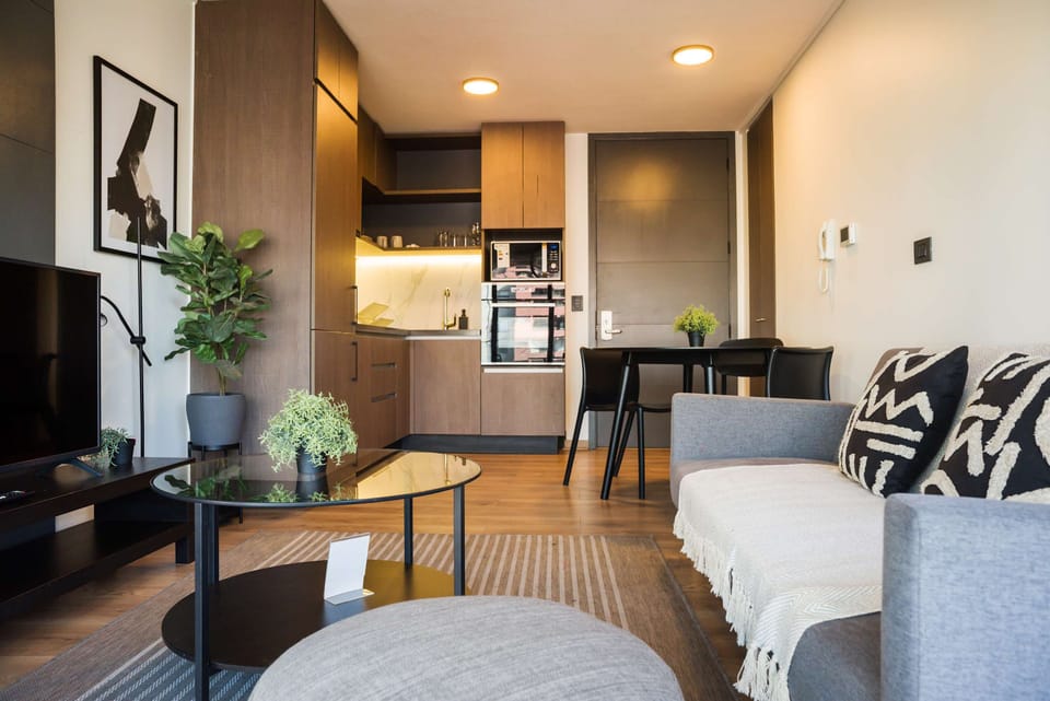 Cozy living area with modern amenities and stylish decor, perfect for relaxation and entertainment.