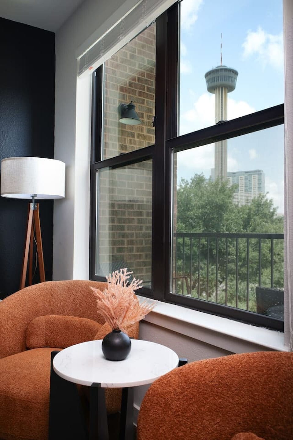 A perfect space to relax, our living room features a large TV, cozy seating, and charming artistic details.