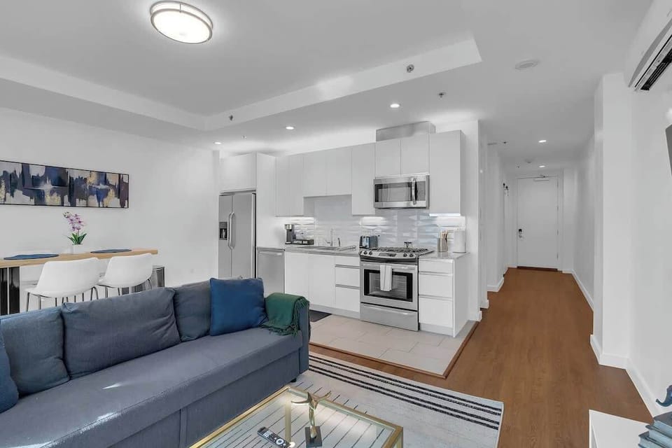 Relax on the comfy couch, enjoy the TV, or get some work done at the dedicated workstation in the open-concept living area.