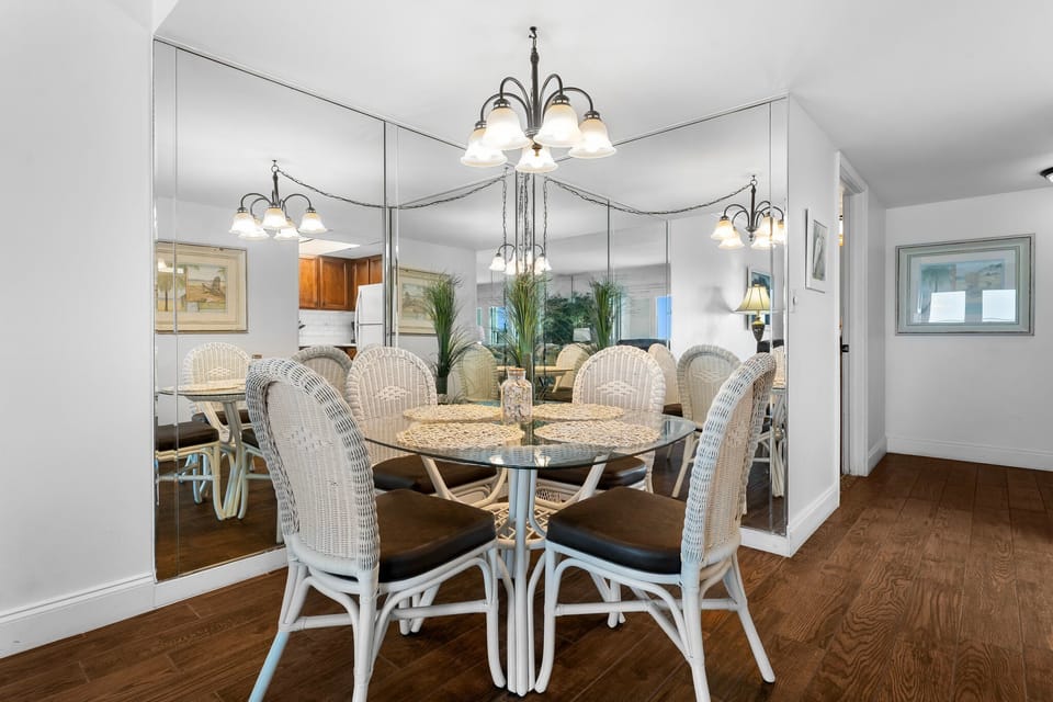 There is a dining table, perfect for enjoying a meal or playing a game, as well as additional breakfast bar seating.