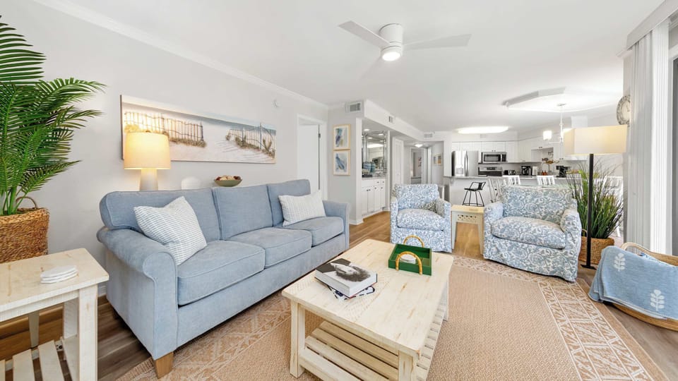 Drop your bags and settle into this breezy, open-concept living and kitchen space. 