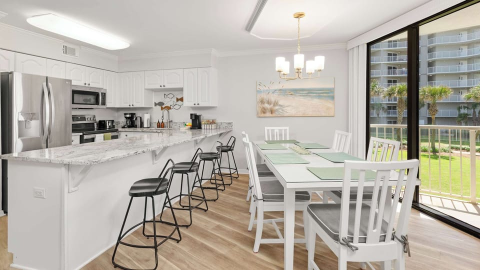 The dining table has seating for 6, while the counter bar has an additional 4 seats. 