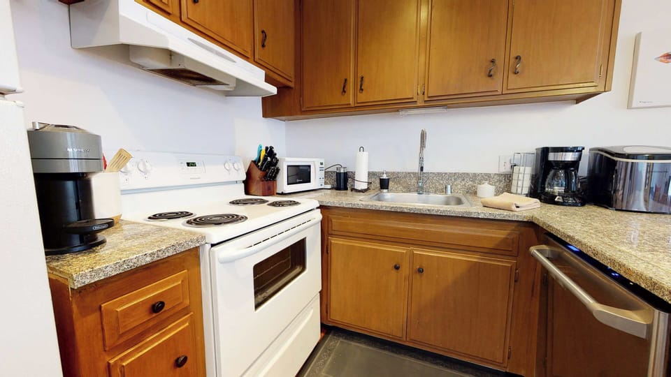 Kitchen with Nespresso, drip coffee pot, slow cooker, blender and more