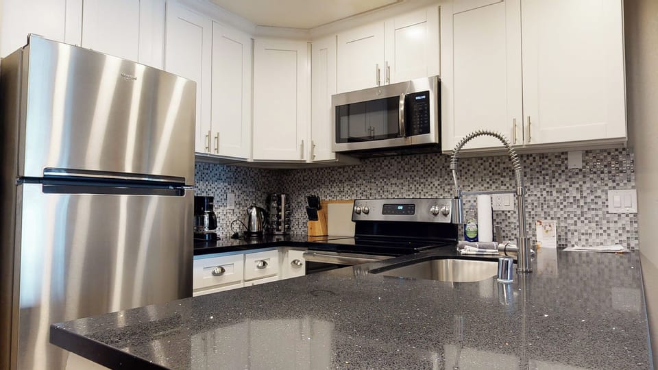 Full kitchen with stainless-steel appliances