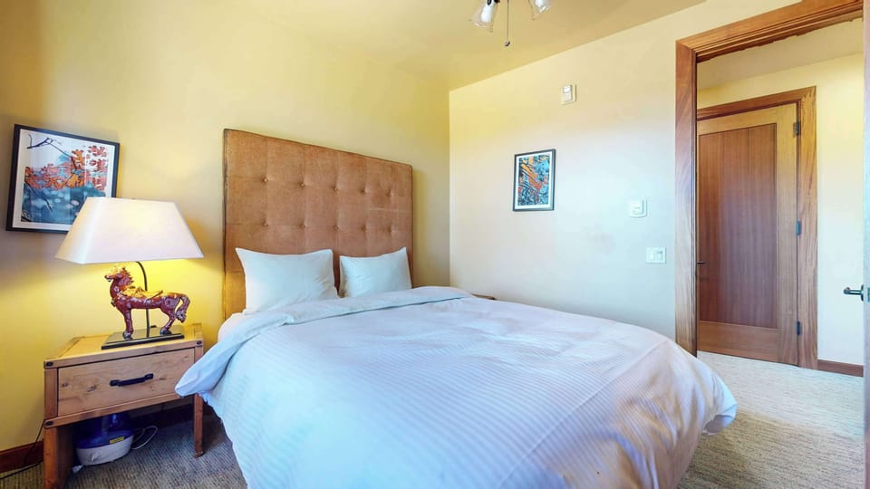 Bedroom 2 with queen bed and Smart TV