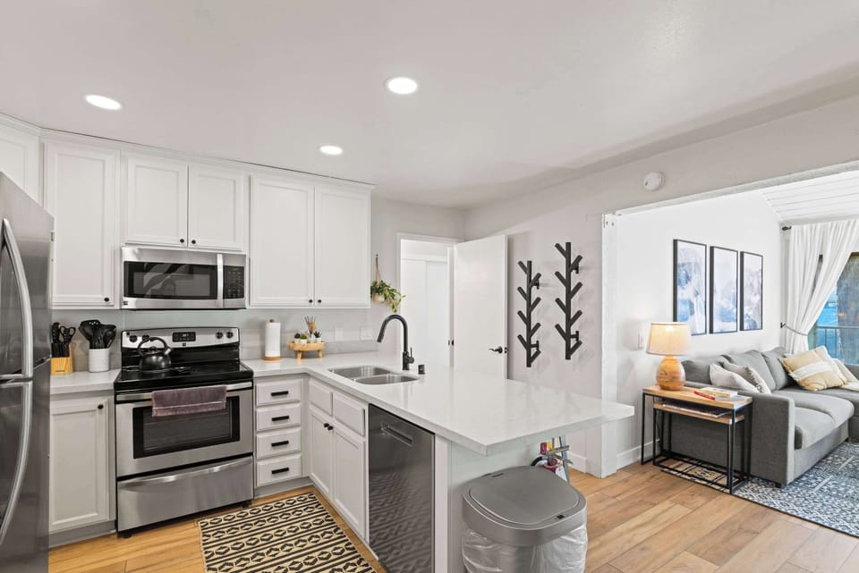 Kitchen with drip coffee pot, slow cooker, blender, toaster, and more