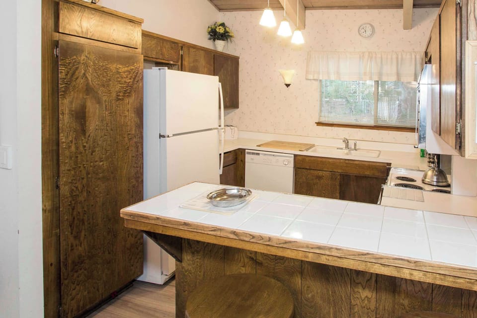 Kitchen with drip coffee pot, dishwasher, blender, slow cooker and more