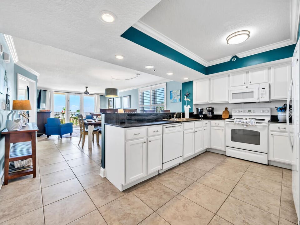 Your fully equipped kitchen offers everything you need to prepare meals while enjoying stunning ocean views through the living room windows.