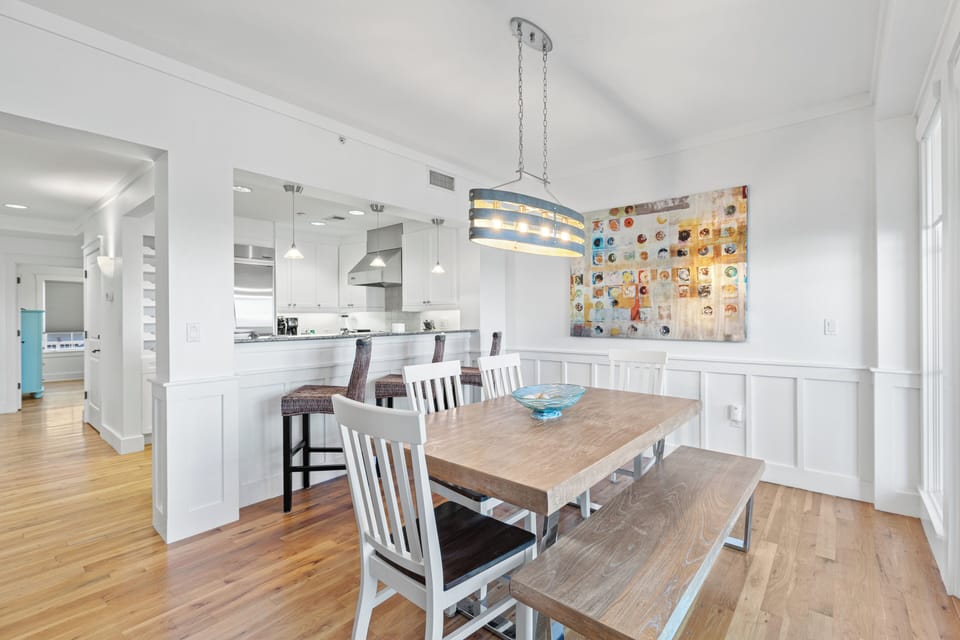 Your stylish open-concept dining space flows seamlessly into the modern kitchen, perfect for memorable meals together.