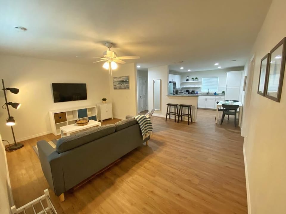 Relax in a stylish space that perfectly blends modern design with beachy vibes.