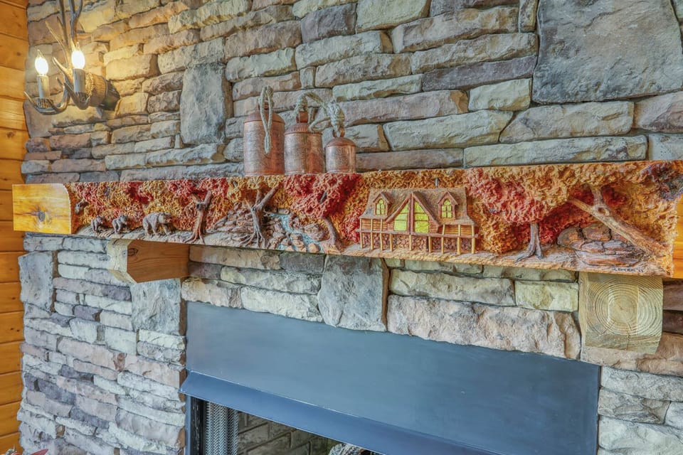 Custom carved mantle of Copper Elk cabin with bears.