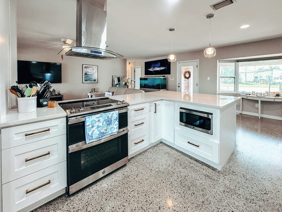Elevate your cooking! Fully stocked kitchen with bay view dining.
