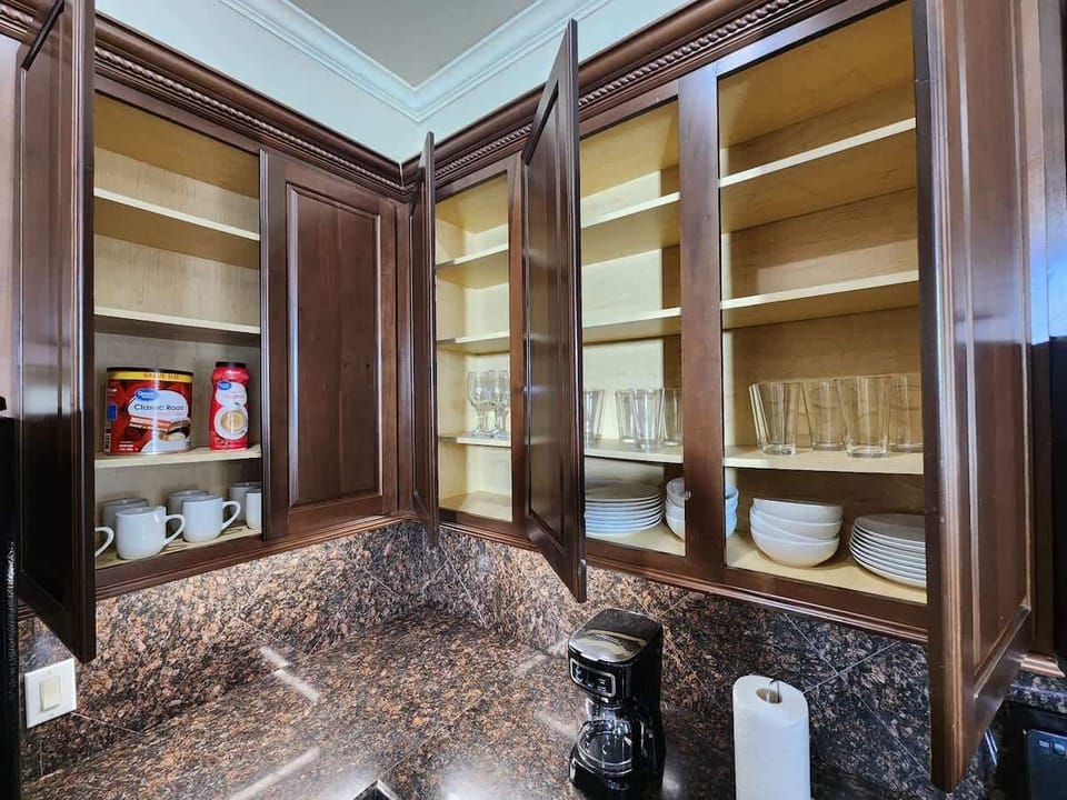Warm kitchen with wood cabinets and granite countertops.
