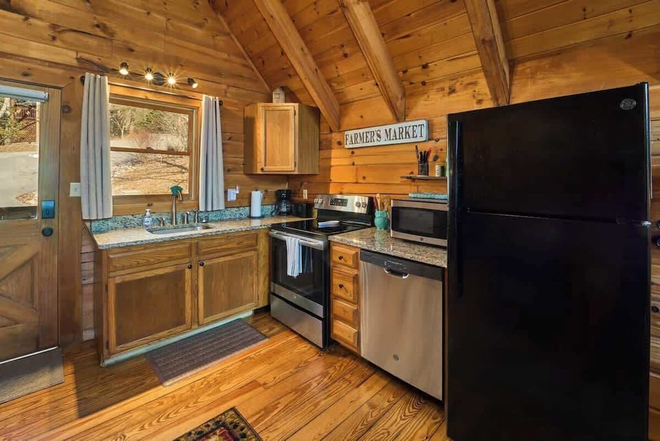 The kitchen features granite countertops, quality appliances and is fully stocked for all of your cooking needs.