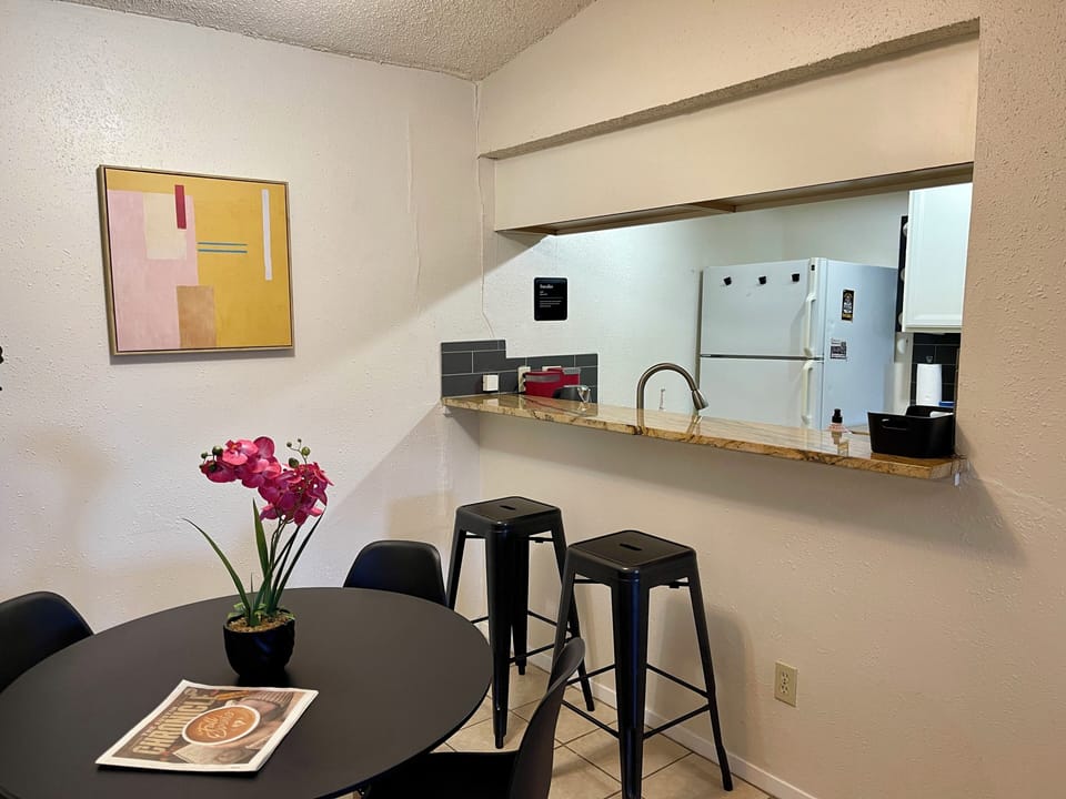 View of dining room and kitchen/bar area