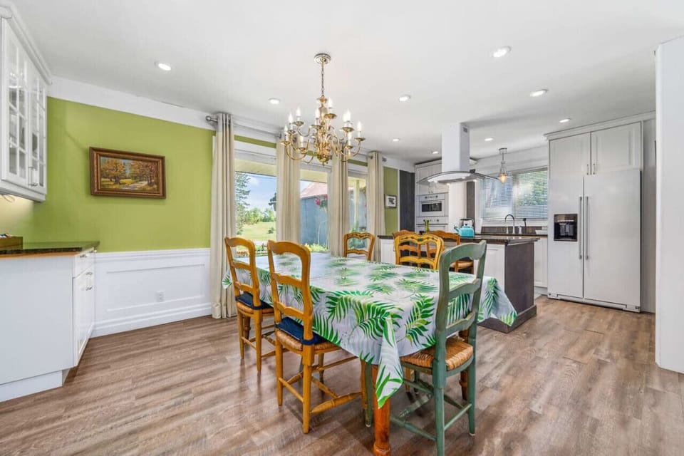 Casual dining beside living room next to kitchen