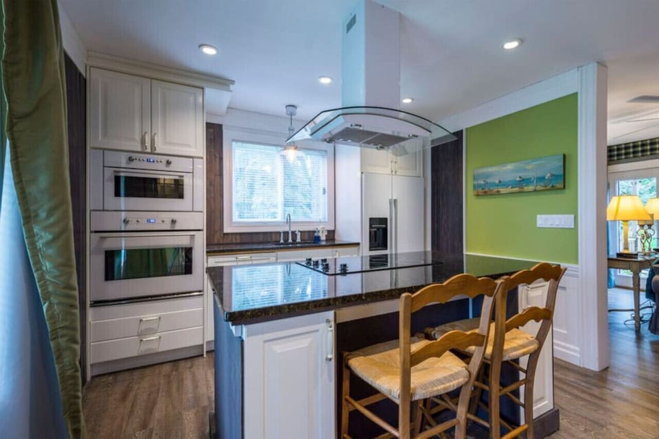 Chefs kitchen with luxury built-in appliances and large island