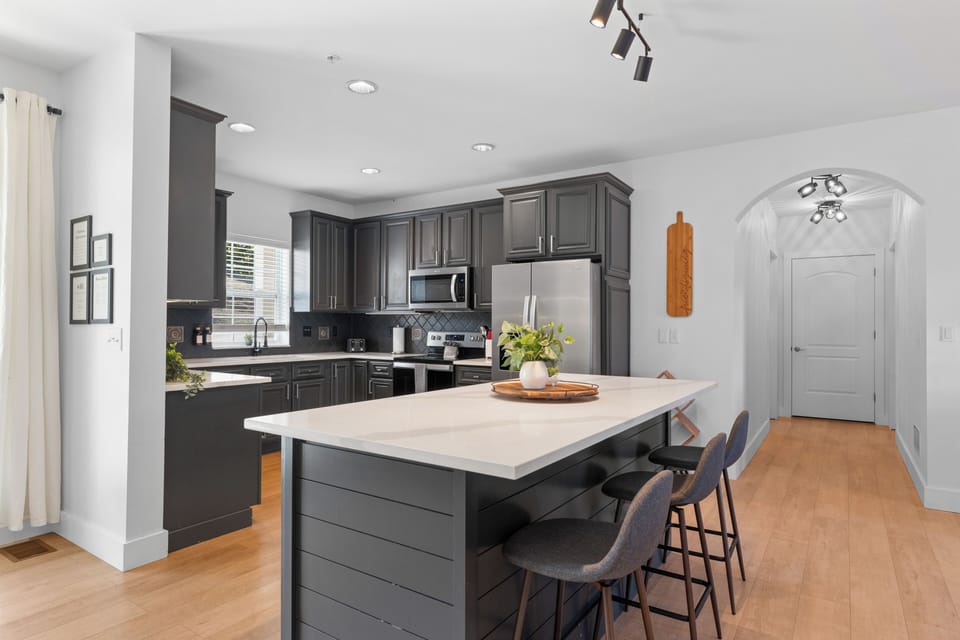 Spacious kitchen stocked to cook a meal or reheat leftovers.