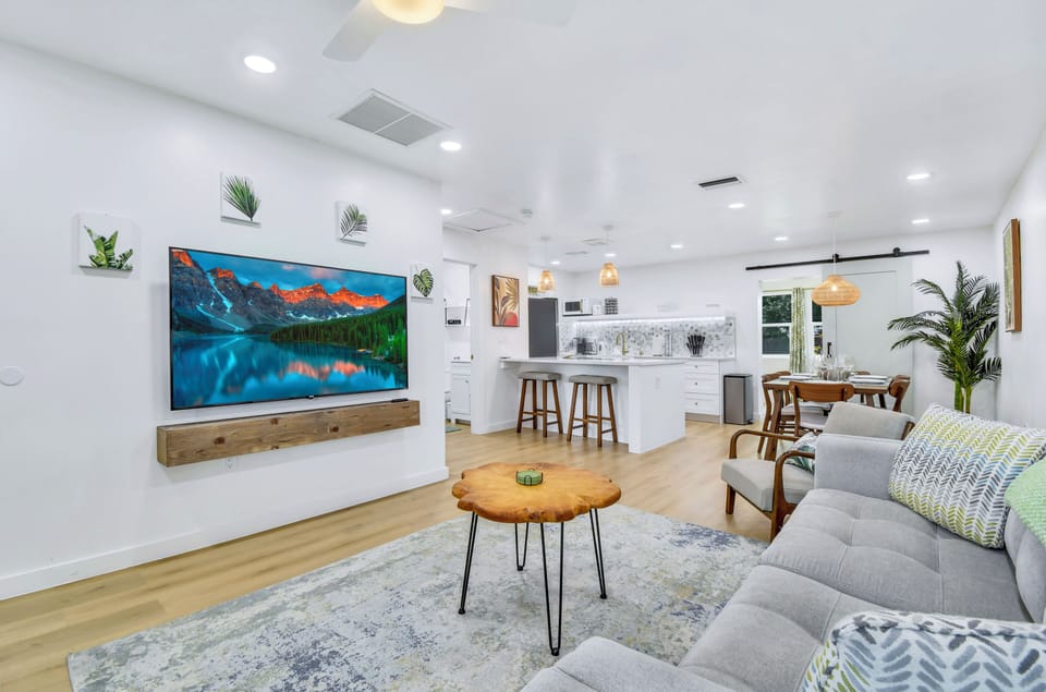 Relax on the deep, soft couch and enjoy the latest movies on the 65" Smart TV!