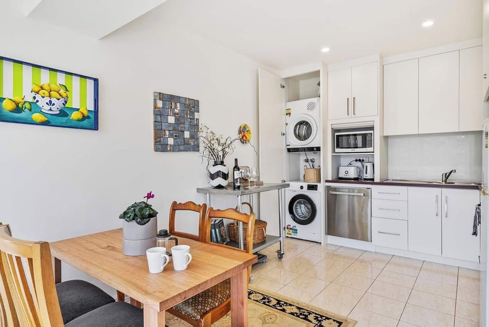 Hidden laundry with washing machine and dryer.