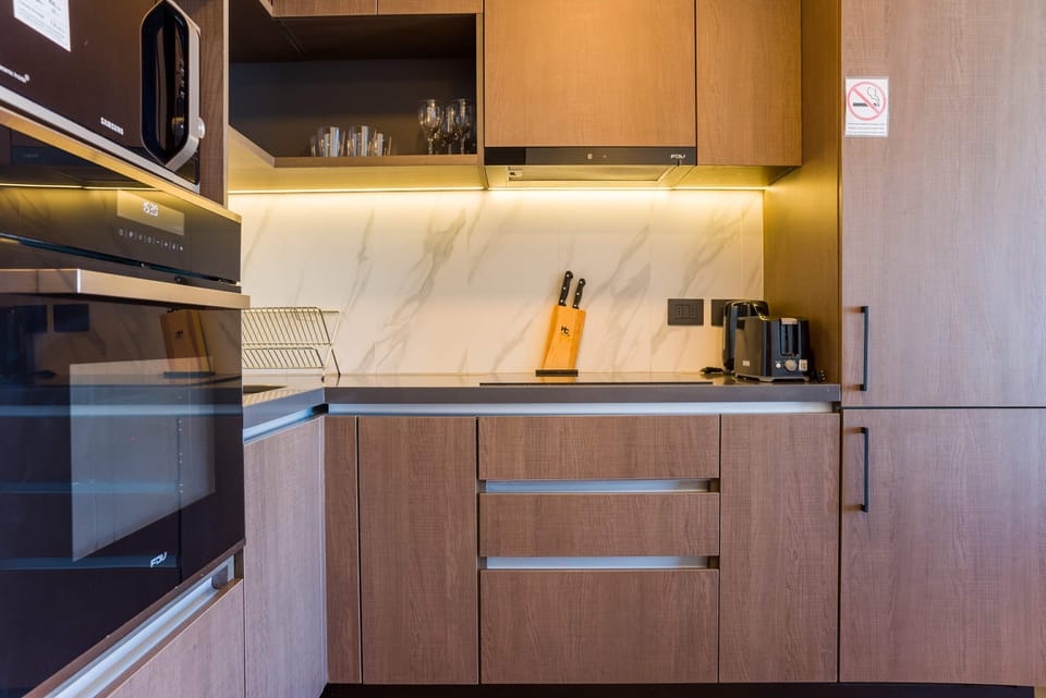 Sleek and modern kitchen with top-notch appliances and elegant finishes, perfect for culinary enthusiasts.