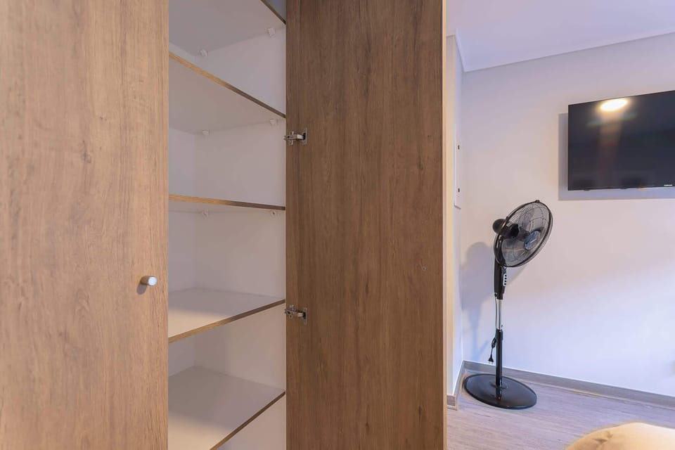 Spacious storage and modern amenities in a cozy studio setting.