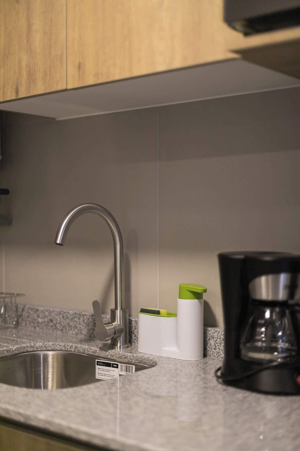 Cozy and functional kitchen space with modern amenities, perfect for preparing a quick meal or enjoying a fresh cup of coffee.