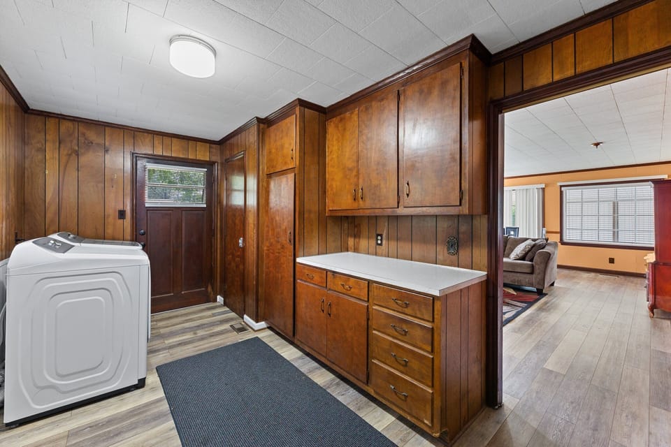 Spacious laundry room equipped with washer and dryer.