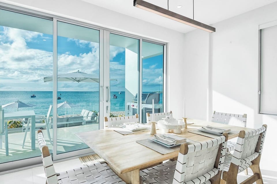 Dining room with seating for six with beach views.