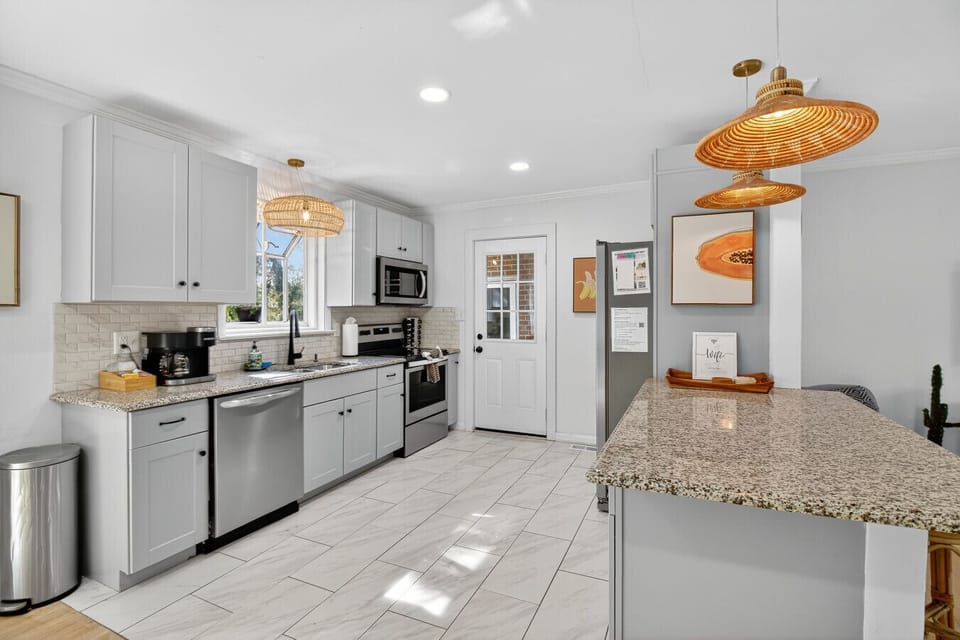 Cook with ease in the fully equipped kitchen, complete with stainless steel appliances, granite counters, and plenty of space to create.