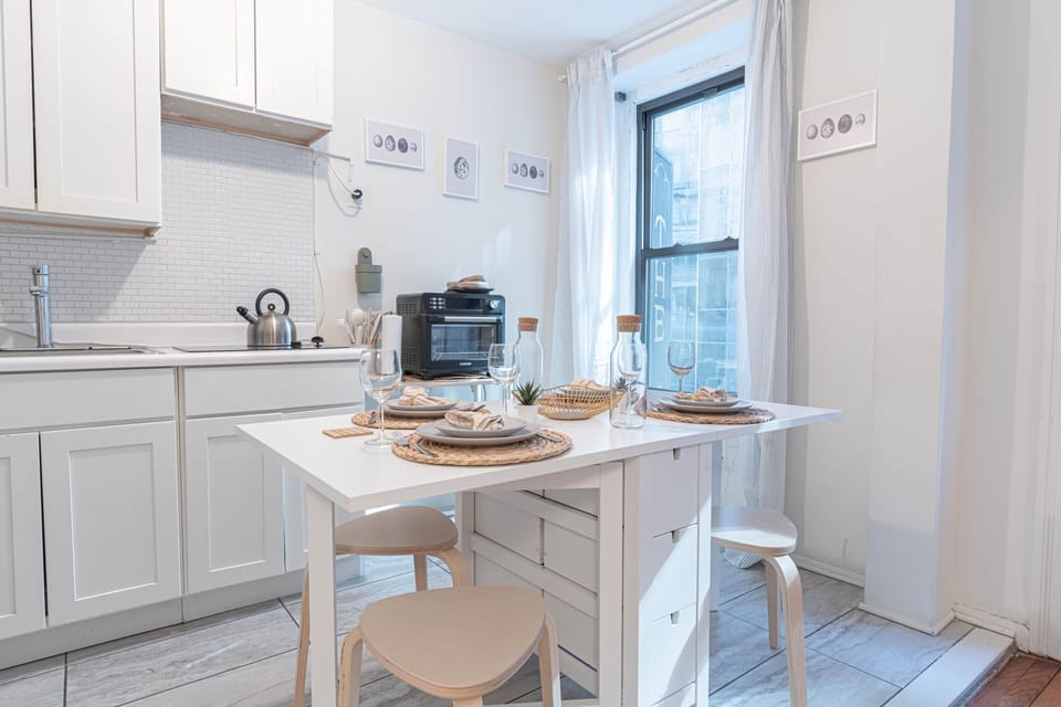 Bright dining nook by the window, perfect for cozy meals & morning coffee