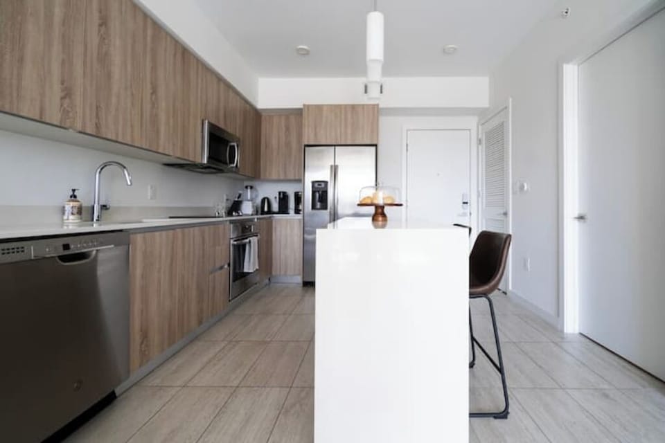 Fully equipped kitchen with sleek appliances and spacious counter space.
