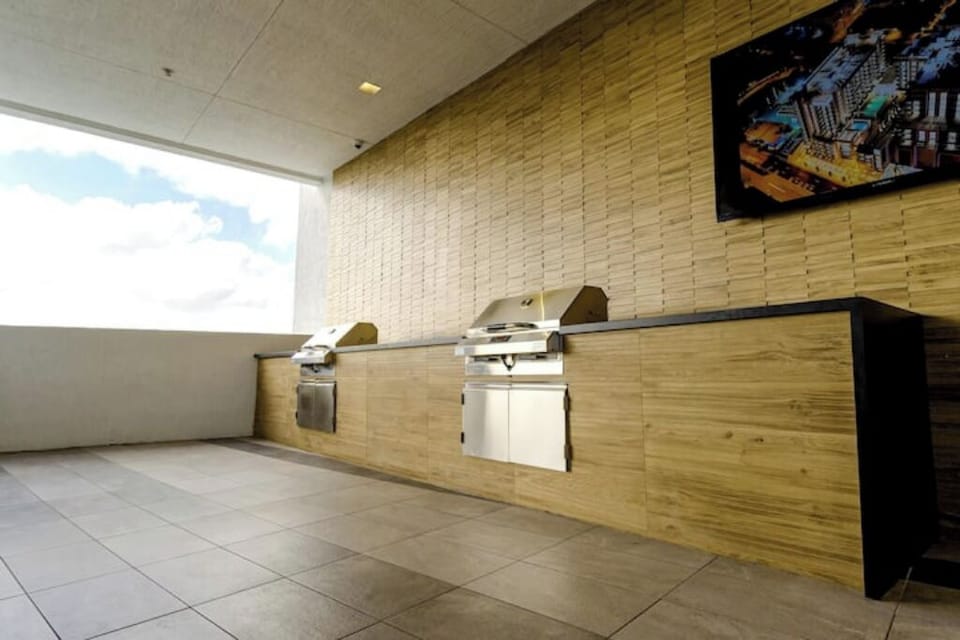 Outdoor grills are available on the pool deck.