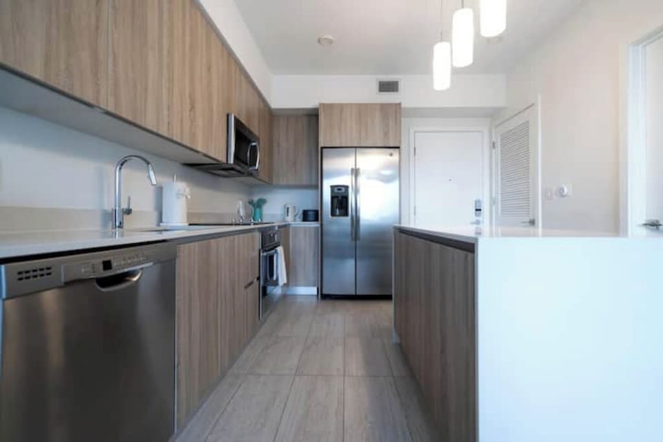 A modern, fully equipped kitchen with stainless steel appliances.