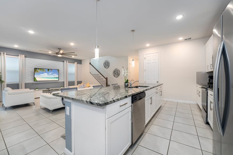 Nice kitchen with granite counters, modern appliances, and an open layout. Great for gatherings!