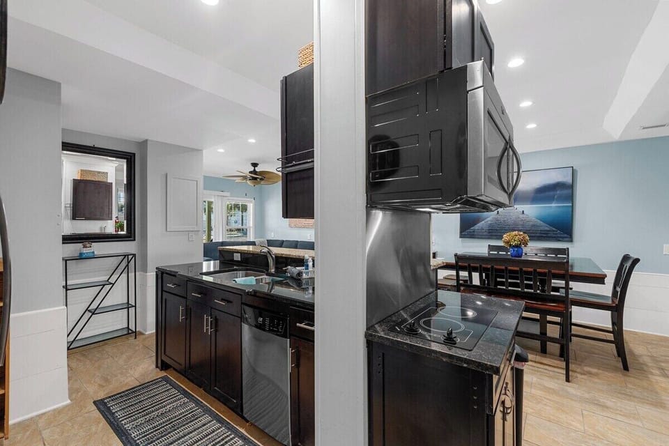 A fully equipped kitchen designed for convenience, featuring accessible countertops and appliances.