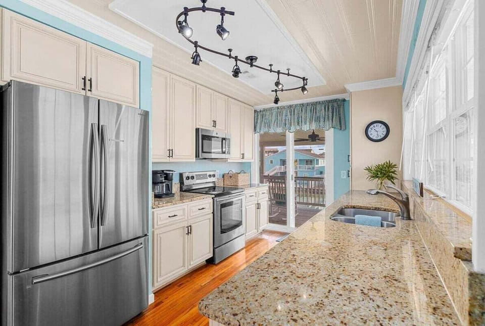 Prepare meals with ease in this spacious, accessible kitchen featuring all the essential appliances.
