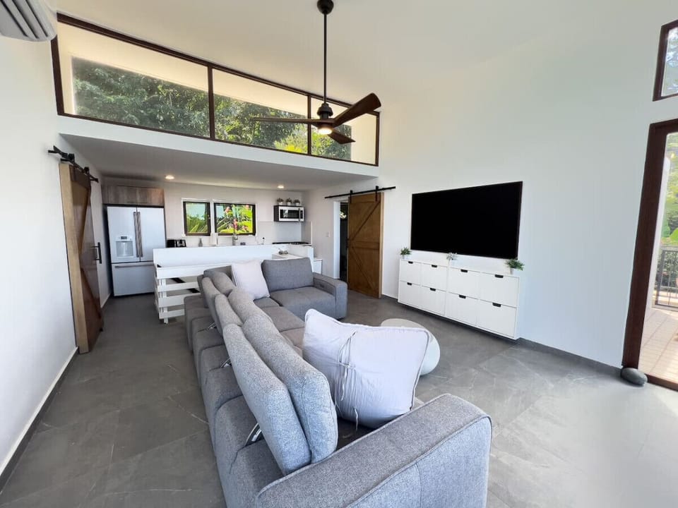 Experience a warm inviting living room created to bring comfort connection and a sense of home