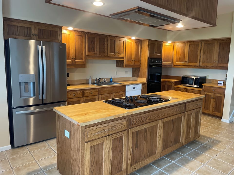 Kitchen: refrigerator and freezer, double ovens, stove, microwave, dishwasher