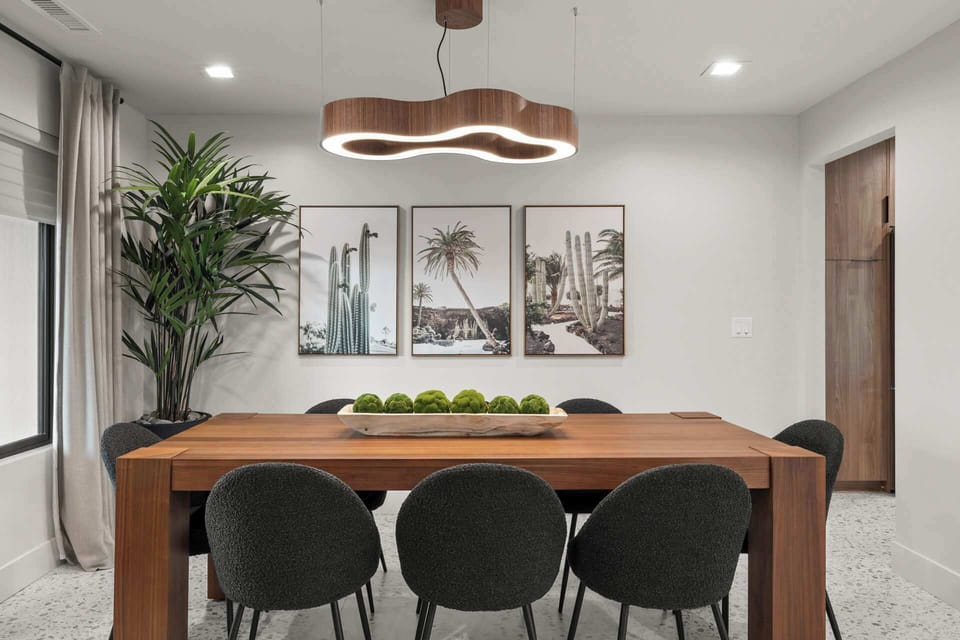 Another view of the dining space with modern decor. 