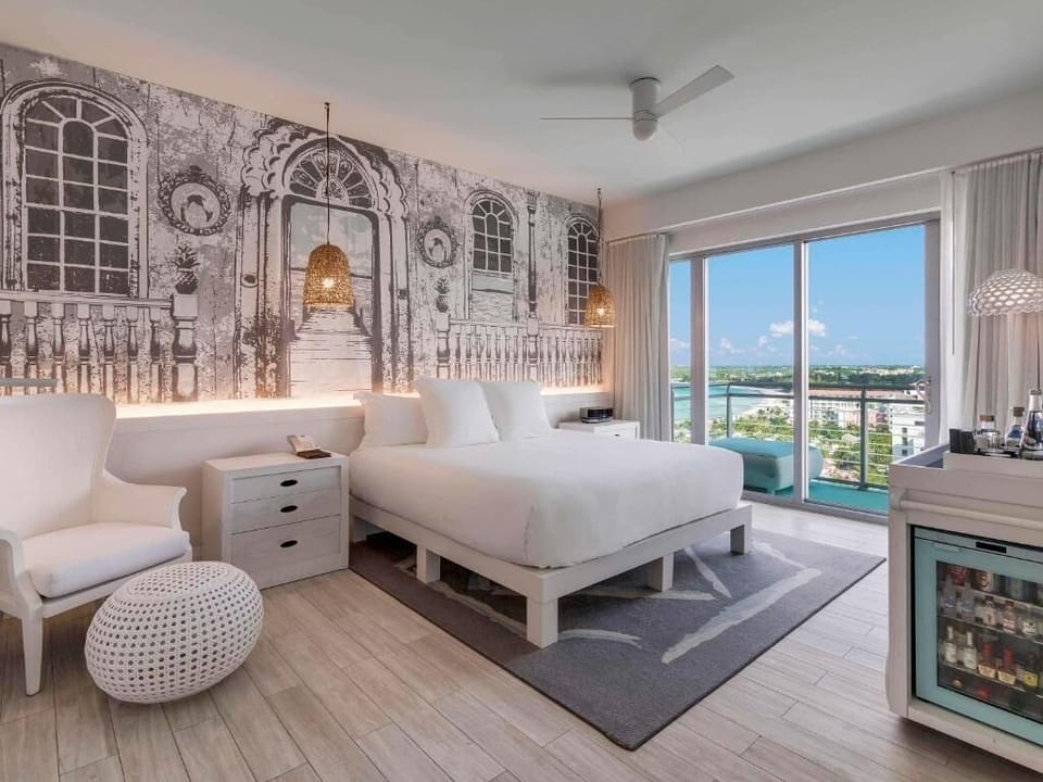 Soak in panoramic water views from your dreamy king bed.