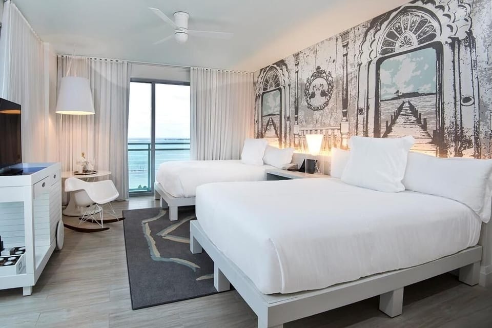 Drift off after beach days in crisp, hotel-style bedding.