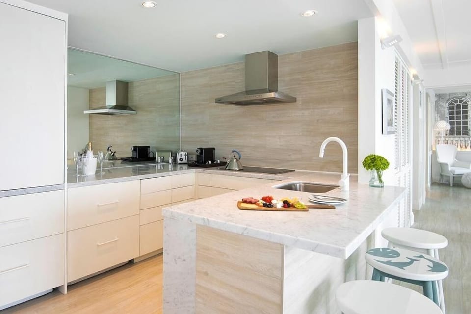 Gather around the marble island for snacks and easy mornings.