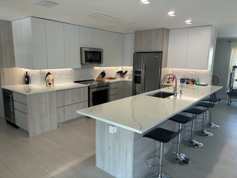 Custom kitchen with under cabinet lighting and KitchenAid appliances